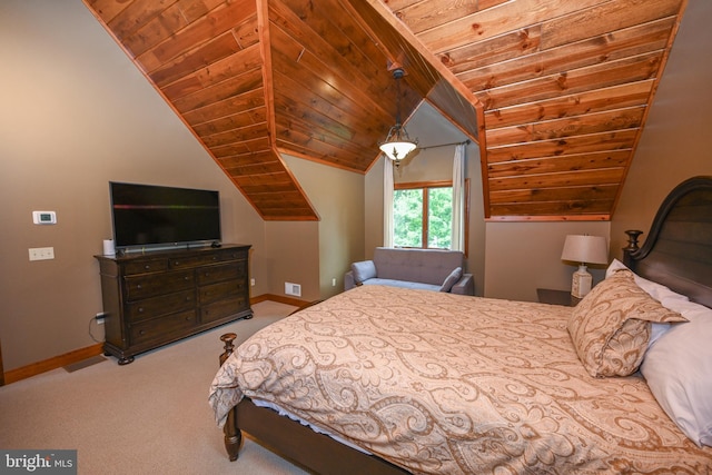 bedroom featuring vaulted ceiling, carpet floors, and wood ceiling