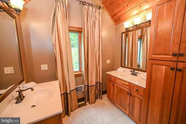 bathroom featuring shower / tub combo, wood ceiling, vaulted ceiling, vanity, and tile patterned flooring