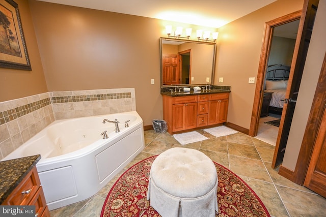 full bathroom featuring connected bathroom, a jetted tub, a sink, and double vanity