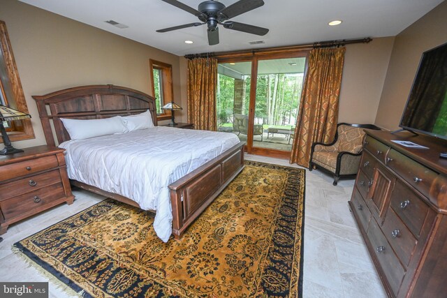 tiled bedroom with ceiling fan and ensuite bathroom