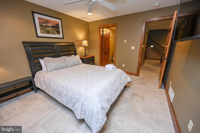 bedroom featuring ceiling fan, visible vents, and baseboards