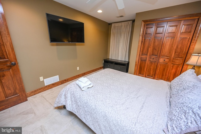 bedroom featuring a closet, visible vents, ceiling fan, and baseboards