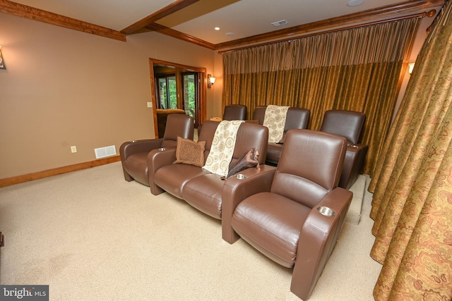 carpeted cinema featuring visible vents, beamed ceiling, and baseboards