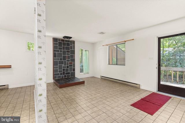 unfurnished living room featuring a baseboard radiator and light tile patterned floors