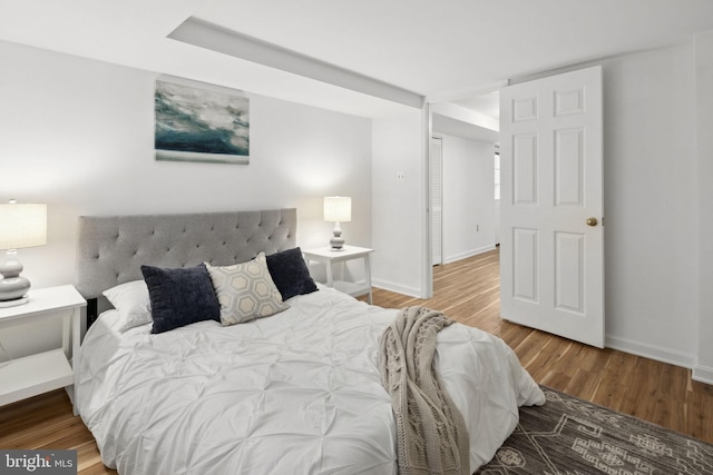 bedroom with hardwood / wood-style floors