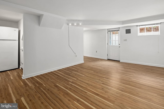 unfurnished living room with hardwood / wood-style flooring