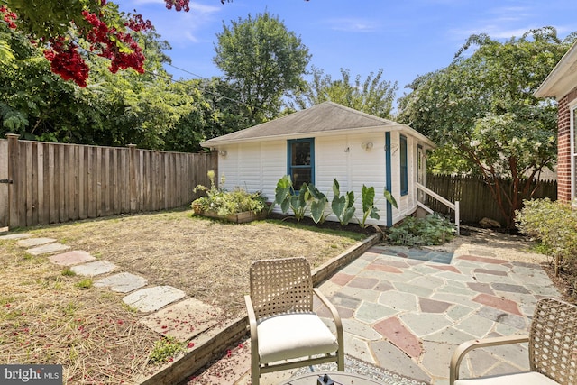 view of patio / terrace featuring an outbuilding