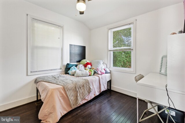 bedroom with ceiling fan, dark hardwood / wood-style flooring, and vaulted ceiling