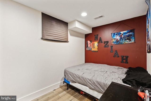 bedroom featuring light hardwood / wood-style floors