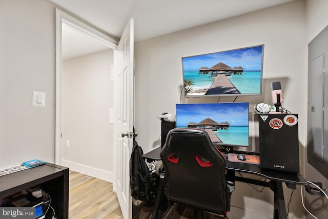 office with light hardwood / wood-style flooring