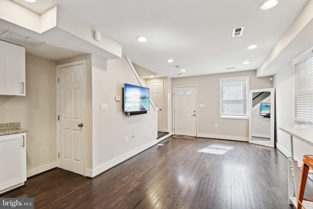 entrance foyer featuring dark wood-type flooring