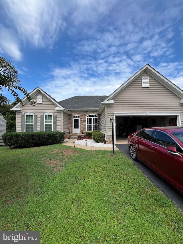 single story home with a garage and a front yard