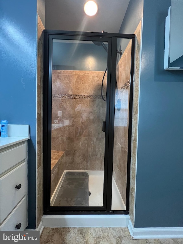 bathroom featuring vanity and walk in shower