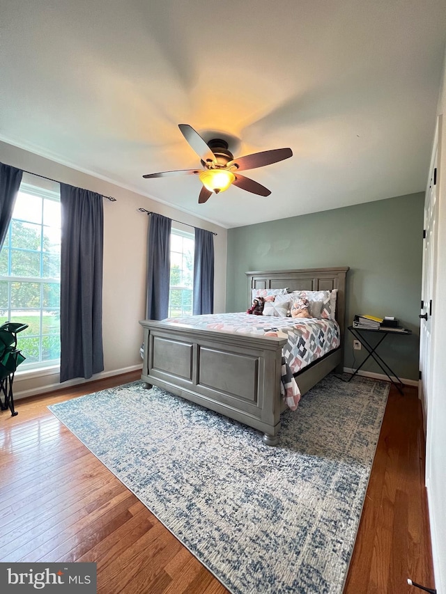 bedroom featuring hardwood / wood-style flooring and ceiling fan