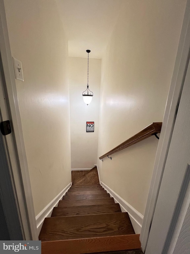 stairs with wood-type flooring