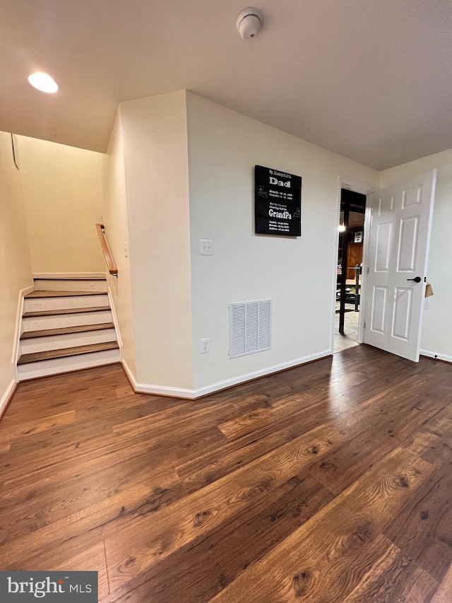 empty room featuring dark wood-type flooring