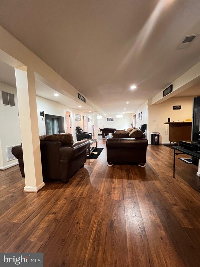 living room with dark hardwood / wood-style floors