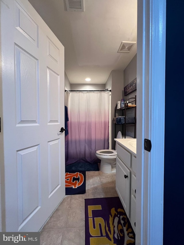 bathroom with tile patterned floors, vanity, toilet, and a shower with shower curtain