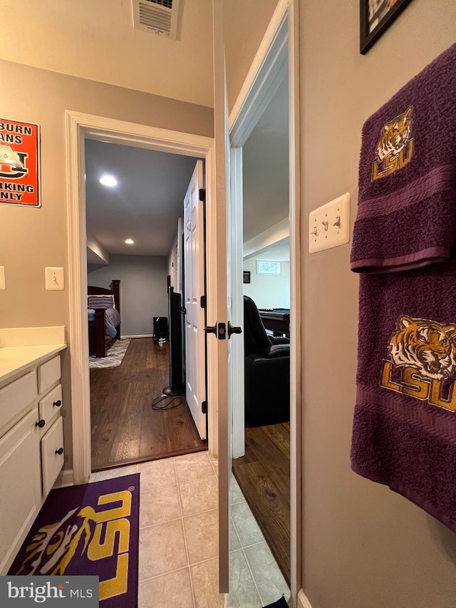 bathroom featuring tile patterned flooring and vanity