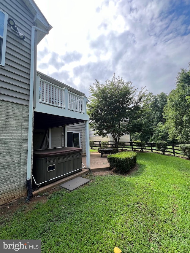 view of yard featuring a patio area and a balcony