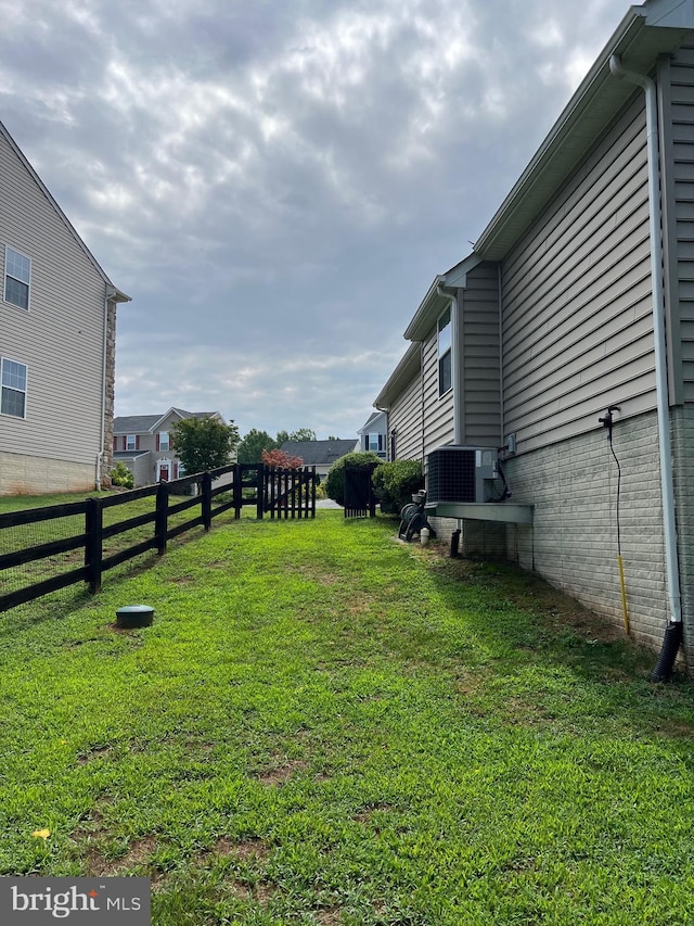 view of yard featuring central air condition unit