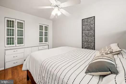 bedroom featuring ceiling fan and hardwood / wood-style floors