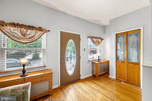 entryway with light hardwood / wood-style floors