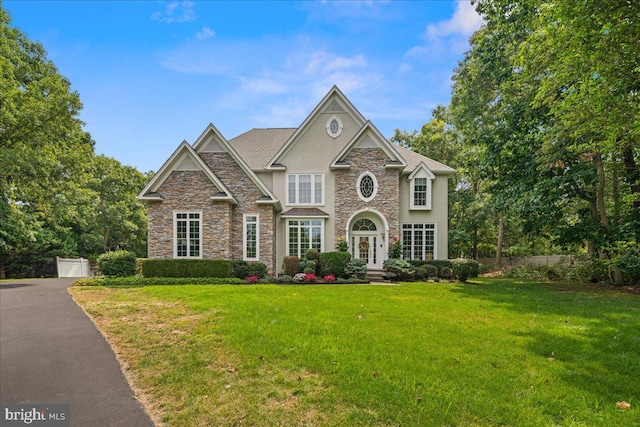 view of front facade with french doors and a front yard