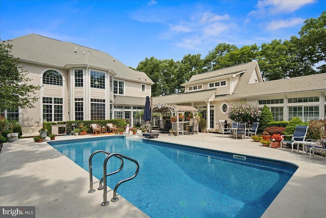 view of pool featuring a patio area and a pergola