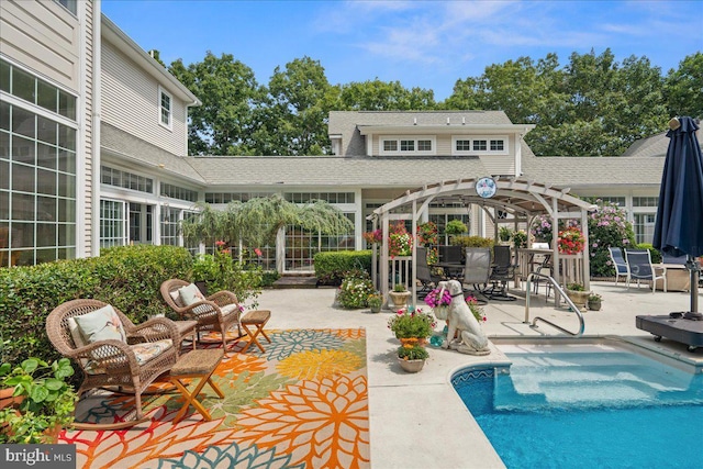 view of pool featuring a pergola and a patio area