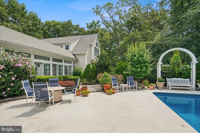 view of pool featuring a patio area