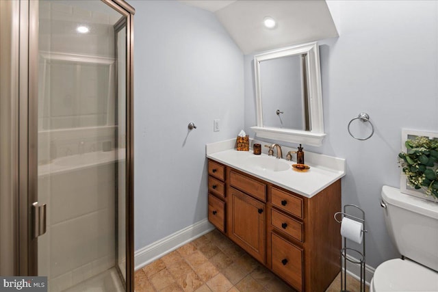 bathroom featuring vanity, vaulted ceiling, toilet, and walk in shower