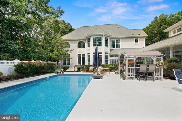 view of pool featuring a patio area