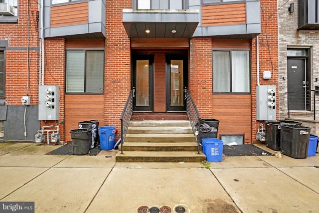 doorway to property featuring cooling unit