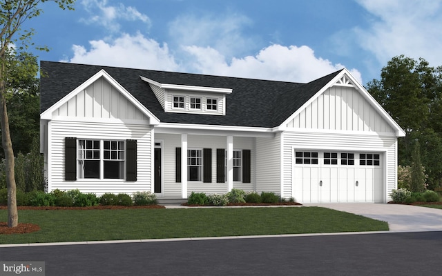 view of front of house featuring covered porch, a front yard, and a garage