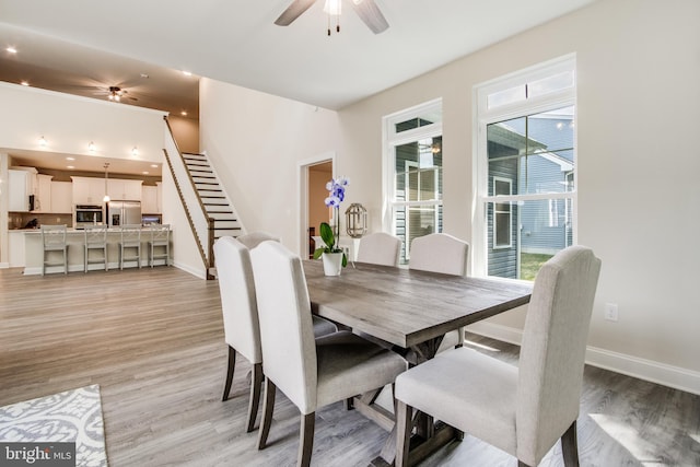 dining space featuring plenty of natural light, light hardwood / wood-style floors, and ceiling fan