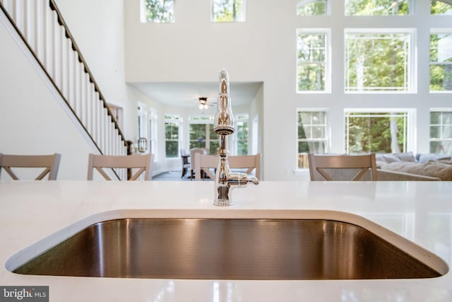 details with a breakfast bar and sink