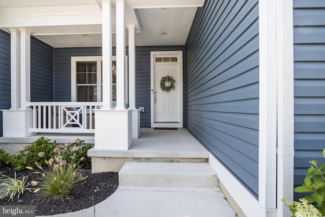 property entrance featuring a porch