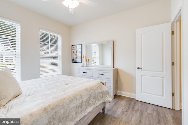 bedroom featuring light hardwood / wood-style floors and ceiling fan