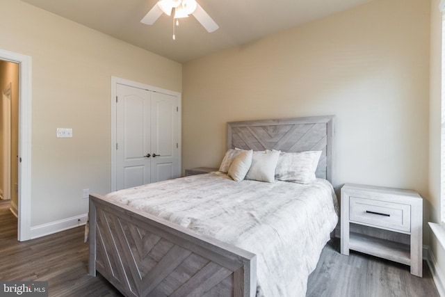 bedroom with ceiling fan, hardwood / wood-style flooring, and a closet