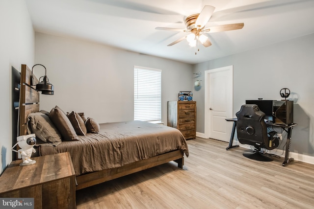 bedroom featuring light wood-type flooring and ceiling fan