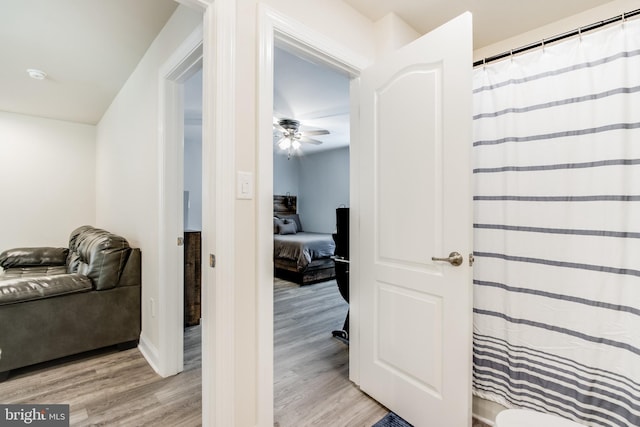 corridor with light hardwood / wood-style flooring