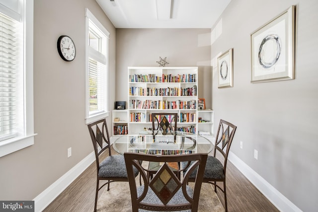 dining area featuring wood-type flooring