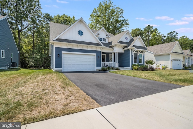 view of front of home featuring a garage and a front yard