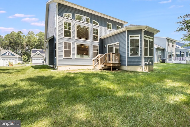 back of property featuring a garage and a lawn