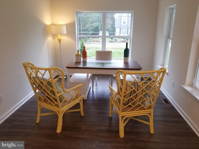 dining area featuring dark hardwood / wood-style flooring