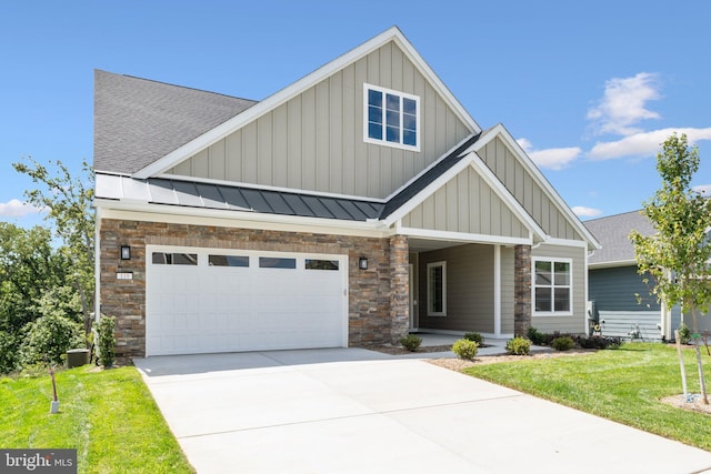 craftsman house featuring metal roof, driveway, board and batten siding, a standing seam roof, and a front yard