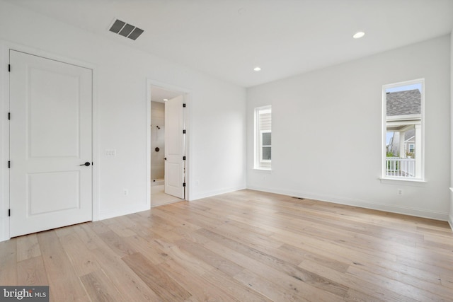 unfurnished bedroom with light wood finished floors, baseboards, visible vents, and recessed lighting