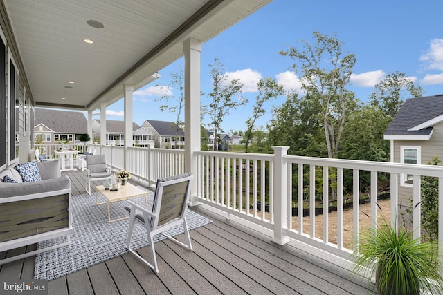 wooden deck with an outdoor hangout area