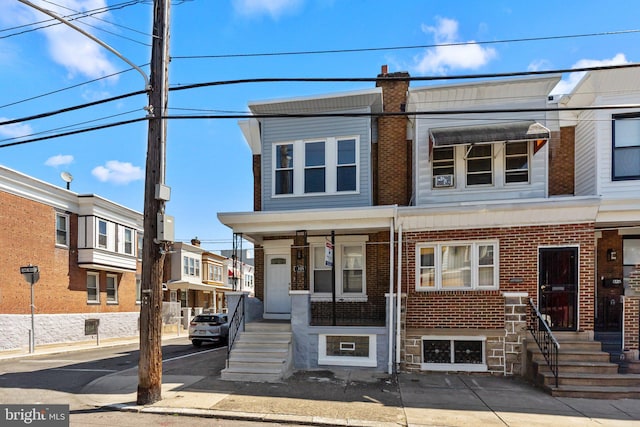 view of property with brick siding